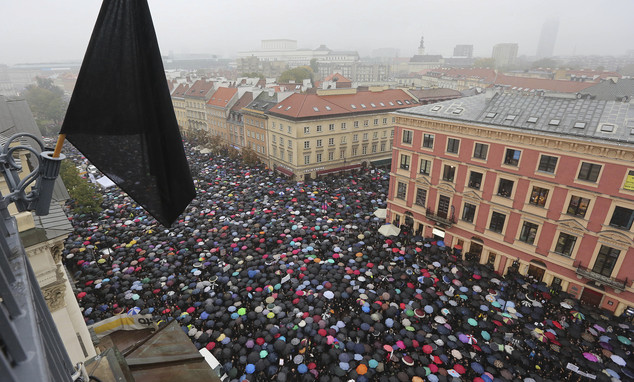 A sea of thousands of umbrellas of women and men participating in a nationwide “Black Monday??? strike to protest a legislative proposal for a total ban on abortion, in downtown Castle Square is pictured in Warsaw, Poland, Monday, Oct. 3, 2016. Massive protests were held in the rain in the streets of Warsaw, Gdansk, Wroclaw and elsewhere across the largely Catholic nation led by a conservative government. (AP Photo/Czarek Sokolowski)